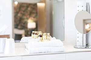 Toiletry bottles and towels